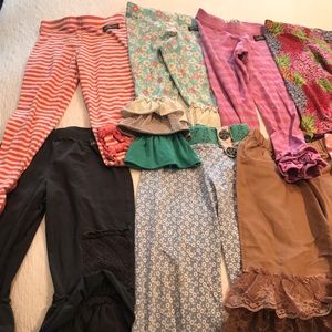 Lot of 11 pairs of pants, and one skirt.